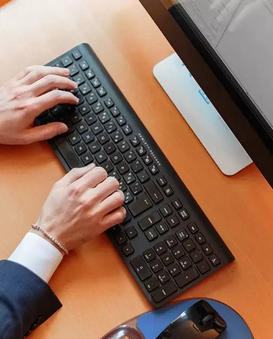 a person hands on keyboard