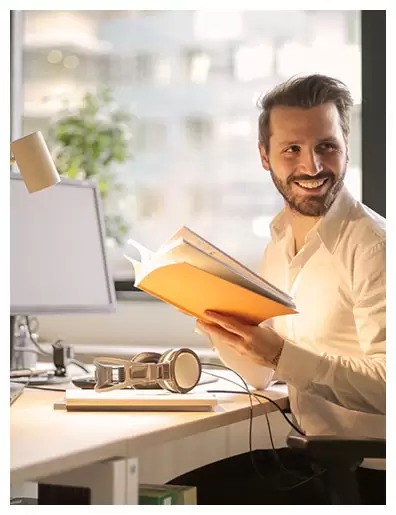 a smiling person working in cabin