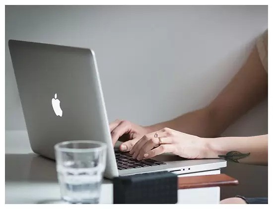 a lady working on a laptop