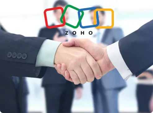 Two people shaking hands, partnering with zoho